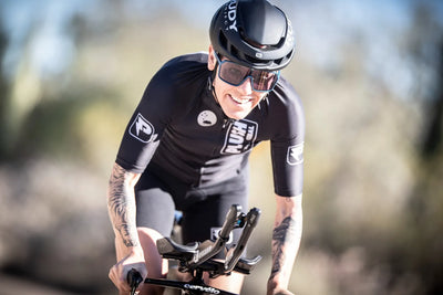 Rudy Project triathlete wearing Spinshield sunglasses with ImpactX unbreakable photochromic lenses