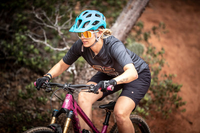 Woman wearing Rudy Project Crossway bike helmet and Spinshield sunglasses while mountain biking