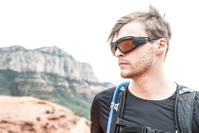 Rudy Project Agent Q sunglasses worn by hiker on red rocks of United States desert southwest