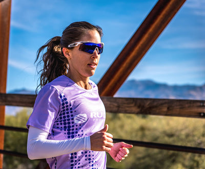Rudy Project Tralyx+ photochromic sunglasses worn by woman running