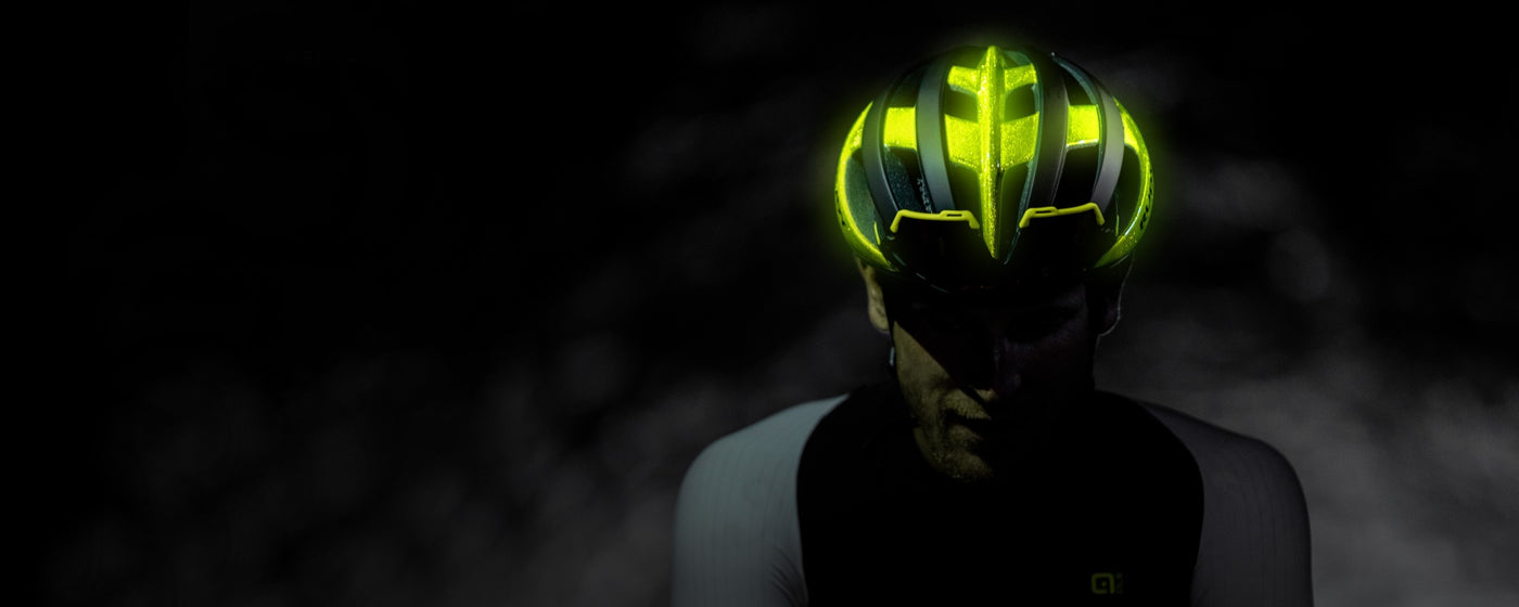 Man in dark wearing Rudy Project Venger hi-vis reflective bike helmet